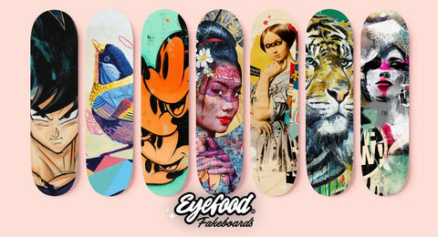 Collection of artistically designed skateboard decks featuring diverse graphic styles and imagery.