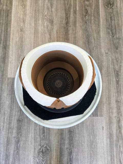 Coffee cup with a spiral pattern visible at the bottom of the liquid.