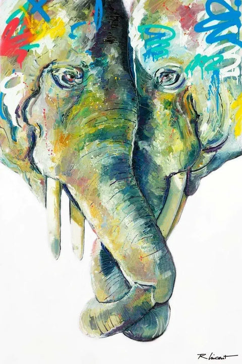 An elephant with colorful paint on it’s face