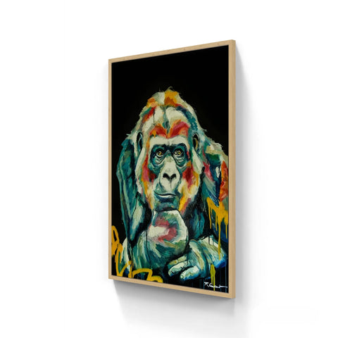 Framed vibrant abstract gorilla painting on a black background.