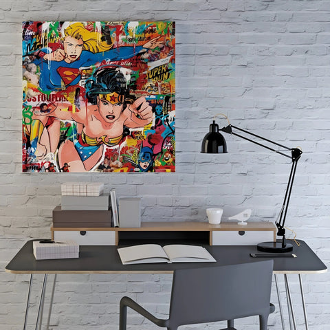 A vibrant pop art canvas featuring Supergirl and Wonder Woman.