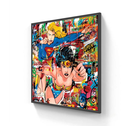 A framed pop art canvas featuring Supergirl and Wonder Woman.