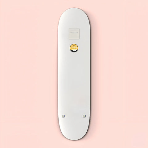 White electronic device resembling a sleek, elongated remote control with a small circular button.