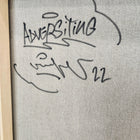 A framed painting with the words `’person’written on it
