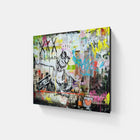 A large canvas with a painting of a man playing guitar