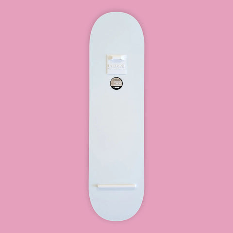 A minimalist white skateboard deck with a smooth, glossy finish and subtle branding stickers near the top.