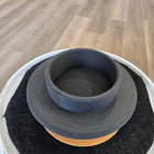 Ceramic or pottery vessel with a wide brim and layered circular design in gray, black, and orange tones.