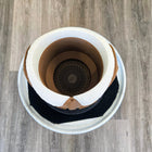 Coffee cup with a spiral pattern visible at the bottom of the liquid.