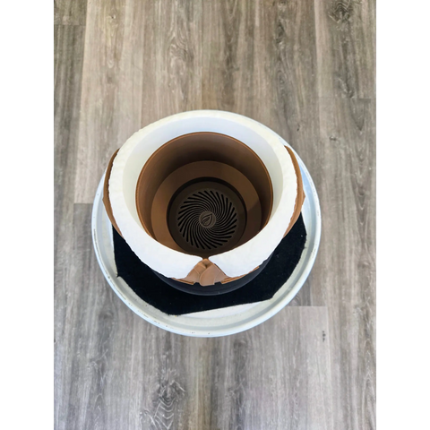 Coffee cup with a spiral pattern visible at the bottom of the liquid.