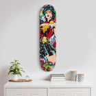 Colorful skateboard deck featuring a pop art-style Wonder Woman illustration.