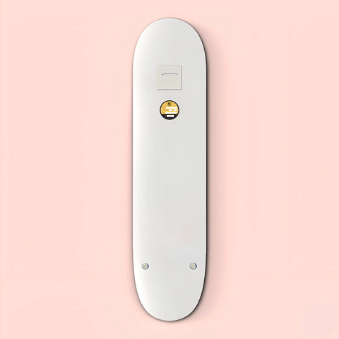 White electronic device resembling a sleek, elongated remote control with a small circular button.