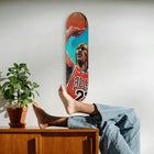 Basketball-themed skateboard deck featuring a player in a red Bulls jersey.