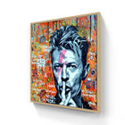 Street art portrait with a ’shh’ gesture against a vibrant graffiti background.