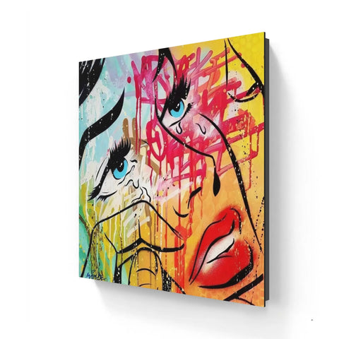 Colorful abstract graffiti-style painting featuring facial features and vibrant splashes of paint.