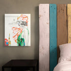 A vibrant, stylized canvas print featuring a woman in an orange and white striped headscarf with green attire.