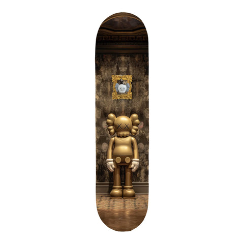 Golden kaws skateboard deck featuring a glossy finish and detailed artwork of the character standing in an ornate, vintage-style room with patterned wallpaper.