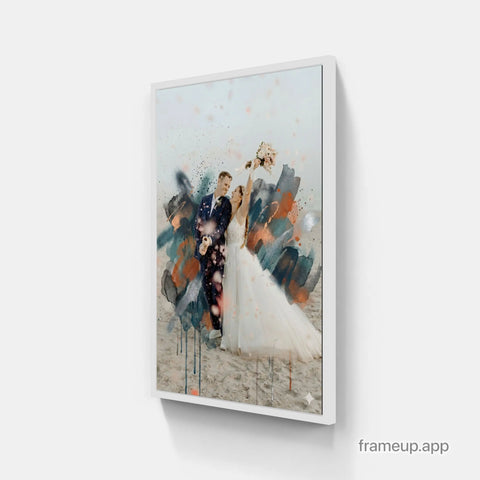 White-framed canvas print featuring a wedding couple with abstract watercolor splashes in teal, orange, and black.