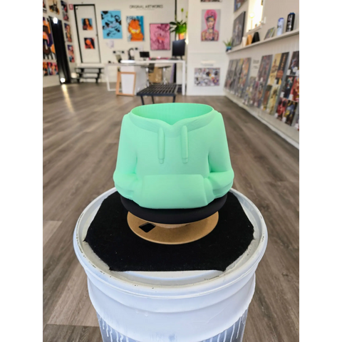 Mint green 3D-printed planter or pot with geometric shapes.