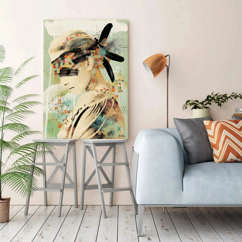 A living room with a couch, a painting and a plant