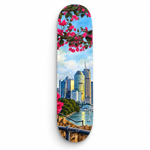 A skateboard deck from kangaroo point cliffs australia keepsake fakeboard with city skyline and pink bougainvillea flowers