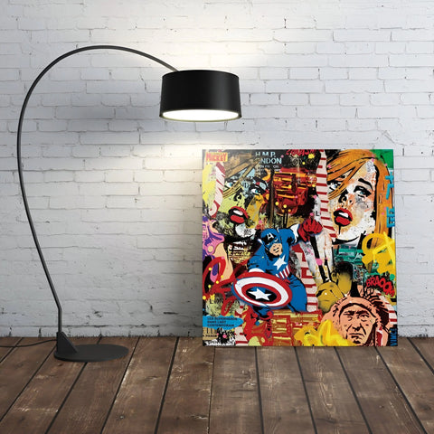 A black arched floor lamp with a drum shade.