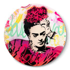 A button with a painting of a woman’s face