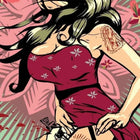A woman in a red dress with tattoos on her arm