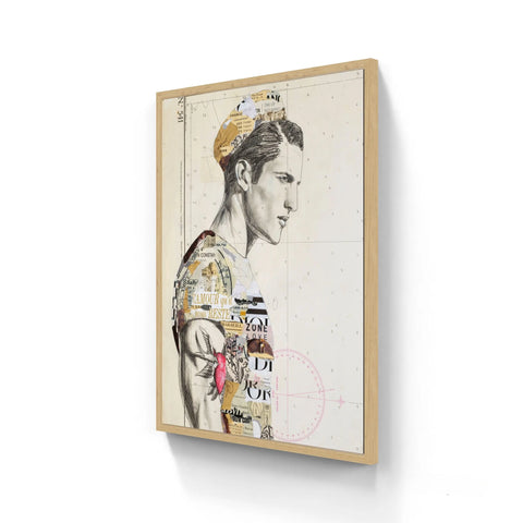 A framed mixed-media artwork featuring a stylized male portrait with collage elements and typography, encased in a light wood frame.
