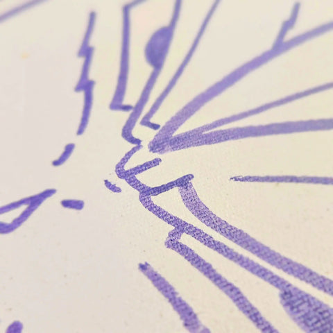 A close up of a purple and white drawing