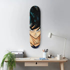 Skateboard deck featuring an anime character’s face and upper body painted on it.