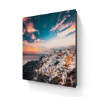 Framed Santorini cityscape print.