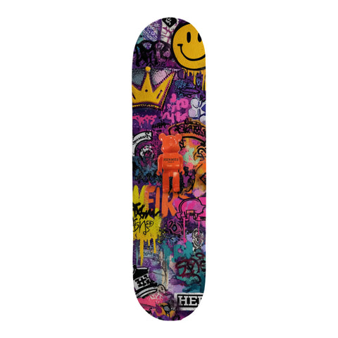Vibrant graffiti-patterned skateboard deck featuring a central orange hermès x bearbrick figure.