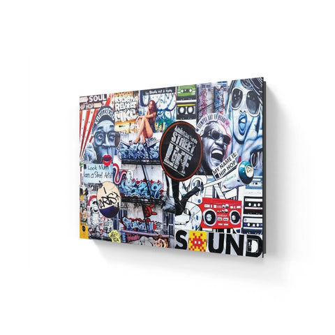Colorful graffiti and street art collage on a wall featuring various images, text, and symbols related to music and urban culture.