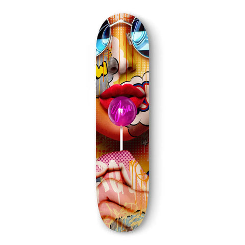Skateboard deck featuring vibrant pop art-style imagery of lips, a lollipop, and abstract elements.